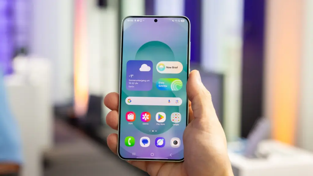 Person holding smartphone with colorful interface